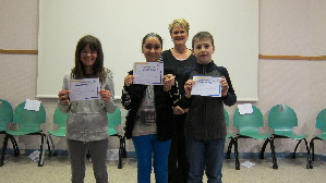 Mrs Geig (head of the college) and the three winners